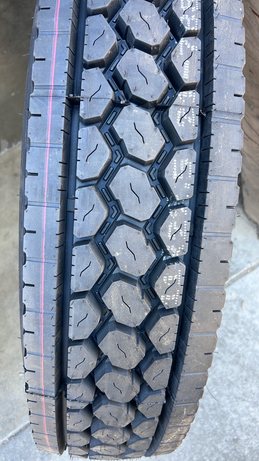 Deep aggressive tread on new commercial tire