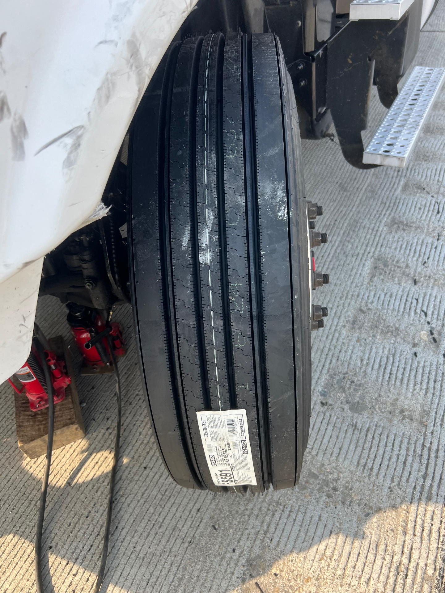 Brand new commercial steer tire installed roadside
