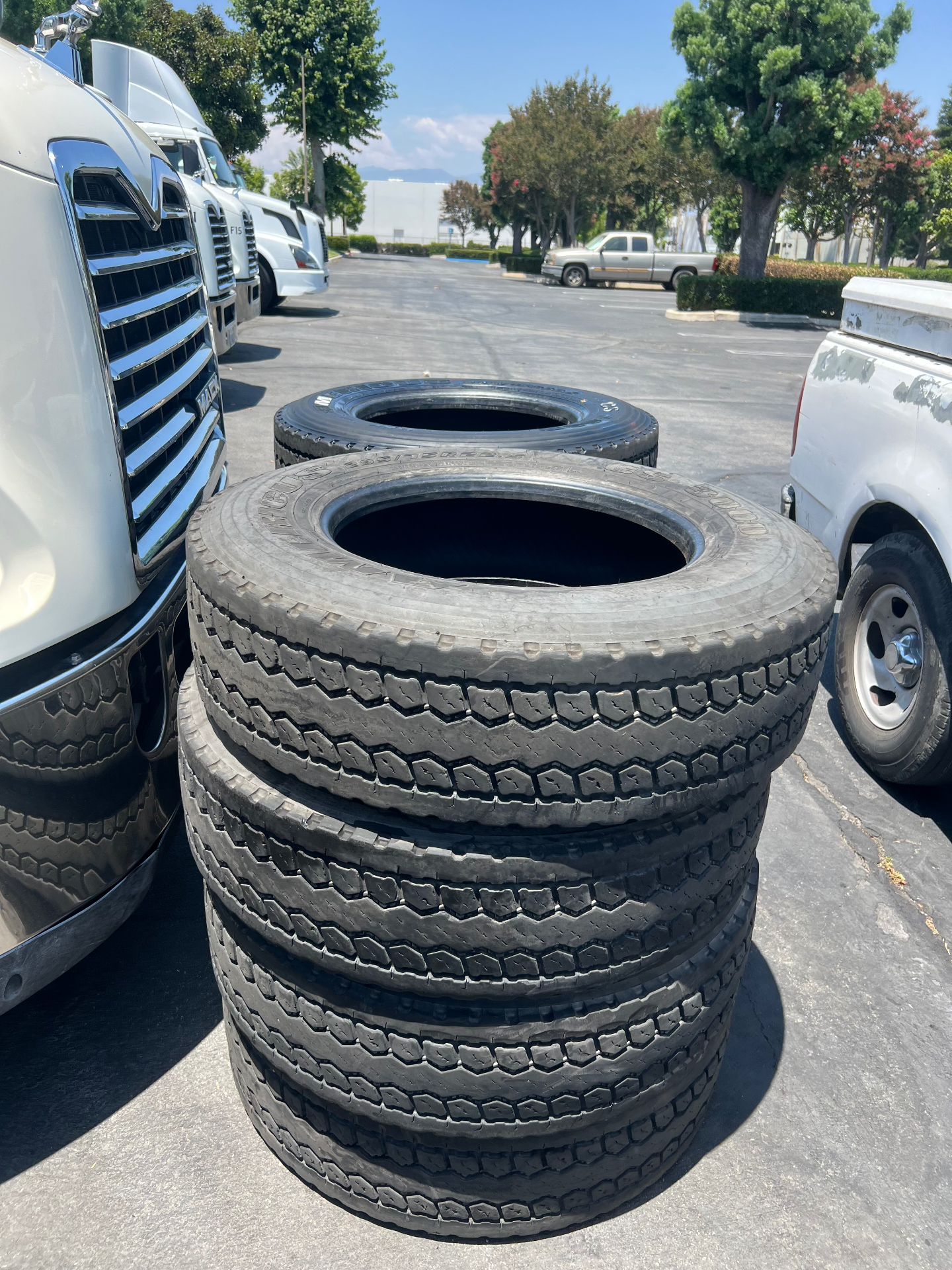 Stack of commercial tires in stock at F&K Tires LLC